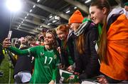 1 December 2023; Jamie Finn of Republic of Ireland takes a photograph with supporters after their side's victory in the UEFA Women's Nations League B match between Republic of Ireland and Hungary at Tallaght Stadium in Dublin. Photo by Seb Daly/Sportsfile