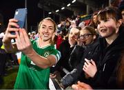 1 December 2023; Megan Connolly of Republic of Ireland takes a photograph with supporters after their side's victory in the UEFA Women's Nations League B match between Republic of Ireland and Hungary at Tallaght Stadium in Dublin. Photo by Ben McShane/Sportsfile