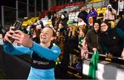 1 December 2023; Republic of Ireland goalkeeper Courtney Brosnan takes a photograph with supporters after their side's victory in the UEFA Women's Nations League B match between Republic of Ireland and Hungary at Tallaght Stadium in Dublin. Photo by Ben McShane/Sportsfile
