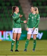 1 December 2023; Republic of Ireland players Caitlin Hayes, left, and Louise Quinn during the UEFA Women's Nations League B match between Republic of Ireland and Hungary at Tallaght Stadium in Dublin. Photo by Seb Daly/Sportsfile