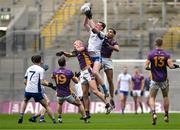 2 December 2023; James Burke of Naas in action against Brian Sheehy, left, and Craig Dias of Kilmacud Crokes during the AIB Leinster GAA Football Senior Club Championship final match between Kilmacud Crokes, Dublin, and Naas, Kildare, at Croke Park in Dublin. Photo by Daire Brennan/Sportsfile