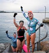 2 December 2023; From right, Elaine Quinn, Susan Osborne and Serena Grimes from South Dublin take part in the Sandycove Polar Plunge which saw participants get “Freezin’ for a Reason” to raise funds for Special Olympics Ireland athletes in an event sponsored by Gala Retail at Sandycove Beach in Dublin. Photo by David Fitzgerald/Sportsfile