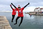 2 December 2023; Liz and Rory Downey from Kinsealy, Dublin takes part in the Sandycove Polar Plunge which saw participants get “Freezin’ for a Reason” to raise funds for Special Olympics Ireland athletes in an event sponsored by Gala Retail at Sandycove Beach in Dublin. Photo by David Fitzgerald/Sportsfile