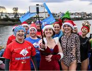 2 December 2023; Ríona Hegarty from Blackrock, Dublin, centre, takes a selfie with members of the Dublin Seals swim club before the Sandycove Polar Plunge which saw participants get “Freezin’ for a Reason” to raise funds for Special Olympics Ireland athletes in an event sponsored by Gala Retail at Sandycove Beach in Dublin. Photo by David Fitzgerald/Sportsfile