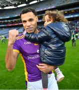 2 December 2023; Craig Dias of Kilmacud Crokes celebrates his side's victory with his daughter Lola after the AIB Leinster GAA Football Senior Club Championship final match between Kilmacud Crokes, Dublin, and Naas, Kildare, at Croke Park in Dublin. Photo by Stephen Marken/Sportsfile