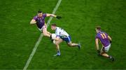 2 December 2023; Paddy McDermott of Naas in action against Shane Walsh, left, and Shane Cunningham of Kilmacud Crokes during the AIB Leinster GAA Football Senior Club Championship final match between Kilmacud Crokes, Dublin, and Naas, Kildare, at Croke Park in Dublin. Photo by Daire Brennan/Sportsfile