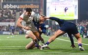 2 December 2023; Jacob Stockdale of Ulster is tackled by Harry Paterson of Edinburgh during the United Rugby Championship match between Ulster and Edinburgh at Kingspan Stadium in Belfast. Photo by Ramsey Cardy/Sportsfile