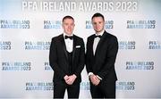 2 December 2023; Jack Moylan of Shelbourne, left, and PFA Ireland chairperson Brendan Clarke on arrival at the PFA Ireland Awards 2023 at Anantara The Marker Dublin Hotel in Dublin. Photo by Stephen McCarthy/Sportsfile