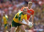 11 July 2004; John Gildea, Donegal, prepares to clear under pressure from Philip Loughran, Armagh. Bank of Ireland Ulster Senior Football Championship Final, Armagh v Donegal, Croke Park, Dublin. Picture credit; Matt Browne / SPORTSFILE