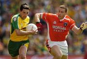 11 July 2004; Michael Hegarty, Donegal, is tackled by Diarmuid Marsden, Armagh. Bank of Ireland Ulster Senior Football Championship Final, Armagh v Donegal, Croke Park, Dublin. Picture credit; Matt Browne / SPORTSFILEE