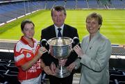 12 July 2004; Geraldine Giles, President of the Ladies Football Association, and Pol O'Gallchoir, TG4 Chief Executive, with Louth captain Karen Rafferty at the launch of the 2004 TG4 Ladies Football Championship, Croke Park, Dublin. Picture credit; David Maher / SPORTSFILE