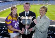 12 July 2004; Geraldine Giles, President of the Ladies Football Association, and Pol O'Gallchoir, TG4 Chief Executive, with Wexford captain Aine Murphy at the launch of the 2004 TG4 Ladies Football Championship, Croke Park, Dublin. Picture credit; David Maher / SPORTSFILE