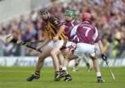 11 July 2004; Ken Coogan, Kilkenny, in action against Fergal Healy, and Fergal Moore, 7, Galway. Guinness Senior Hurling Championship Qualifier, Round 3, Galway v Kilkenny, Semple Stadium, Thurles, Co. Tipperary. Picture credit; Ray McManus / SPORTSFILE