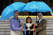 15 July 2004; Lisa Browne, Sponsorship manager, Bank of Ireland, Mayo manager John Maughan, left, and Roscommon manager Tommy Carr with the Nestor Connacht Cup, at a photocall ahead of this weekend's Bank of Ireland Connacht Senior Football Championship final. Bank of Ireland Head Office, Baggot Street, Dublin. Picture credit; Damien Eagers / SPORTSFILE