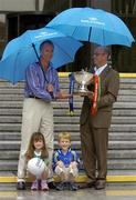15 July 2004; Mayo manager John Maughan, left, and Roscommon manager Tommy Carr, holding the Nestor Connacht cup, with 4 year old twins, Roisin and Sean Stanley at a photocall ahead of this weekend's Bank of Ireland Connacht Senior Football Championship final. Bank of Ireland Head Office, Baggot Street, Dublin. Picture credit; Damien Eagers / SPORTSFILE
