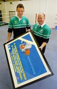 15 July 2004; Andy Lee, left, from Limerick, Middleweight (-75kg) and Ireland's only qualified Olympic boxer, receives a presentation from Ireland's boxing gold medallist in Barcelona Michael Carruth, to mark Andy's departure to training camps and next month's Summer Olympic Games in Athens, at a reception in the National Stadium, Dublin. Picture credit; Brendan Moran / SPORTSFILE