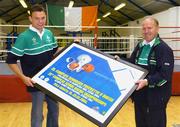 15 July 2004; Andy Lee, left, from Limerick, Middleweight (-75kg) and Ireland's only qualified Olympic boxer, receives a presentation from Ireland's boxing gold medallist in Barcelona Michael Carruth, to mark Andy's departure to training camps and next month's Summer Olympic Games in Athens at a reception in the National Stadium, Dublin. Picture credit; Brendan Moran / SPORTSFILE