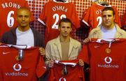 15 July 2004; Manchester United players Wes Brown, Liam Miller and John O'Shea at the launch of the new Manchester United home shirt for the 2004/2005 season, in Champion Sports, Jervis Street Shooping centre, Dublin. Picture credit; Brian Lawless / SPORTSFILE
