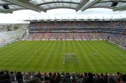 11 July 2004; The teams and fans stand for the National Anthem before the match. Bank of Ireland Ulster Senior Football Championship Final, Armagh v Donegal, Croke Park, Dublin. Picture credit; Brian Lawless / SPORTSFILE