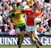11 July 2004; Ronan Clarke, Armagh, in action against Raymond Sweeney, Donegal. Bank of Ireland Ulster Senior Football Championship Final, Armagh v Donegal, Croke Park, Dublin. Picture credit; Brian Lawless / SPORTSFILE