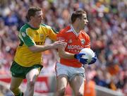 11 July 2004; Paul McGrane, Armagh, in action against Stephen McDermott, Donegal. Bank of Ireland Ulster Senior Football Championship Final, Armagh v Donegal, Croke Park, Dublin. Picture credit; Brian Lawless / SPORTSFILE
