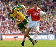11 July 2004; Oisin McConville, Armagh, in action against Eamon McGee, Donegal. Bank of Ireland Ulster Senior Football Championship Final, Armagh v Donegal, Croke Park, Dublin. Picture credit; Brian Lawless / SPORTSFILE