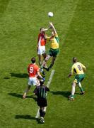 11 July 2004; Donegal's John Gildea and Armagh's Paul McGrane, contest the throw in for the second half as Armagh's Philip Loughran (9) and Donegal's Stephen McDermott (8) await the breaking ball while referee Michael Collins looks on. Bank of Ireland Ulster Senior Football Championship Final, Armagh v Donegal, Croke Park, Dublin. Picture credit; Brian Lawless / SPORTSFILE