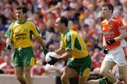 11 July 2004; Damien Diver, Donegal, takes possession ahead of Armagh's Ronan Clarke and team-mate Nial McCready. Bank of Ireland Ulster Senior Football Championship Final, Armagh v Donegal, Croke Park, Dublin. Picture credit; Matt Browne / SPORTSFILE