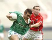 17 July 2004; Colm Bradley, Fermanagh, is tackled by Sean O'Brien, Cork. Bank of Ireland Senior Football Championship Qualifier, Round 3, Cork v Fermanagh, Croke Park, Dublin. Picture credit; Damien Eagers / SPORTSFILE