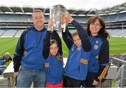 7 September 2013; On the eve of the All-Ireland Hurling Final, Clare hurling legend Jamesie O’Connor gave a unique tour of Croke Park stadium as part of the Bord Gáis Energy Legends Tour Series. Pictured holding the Liam MacCarthy Cup at the tour are the Jones Family, from left, Alfie, Áine, aged 8, Ciarán, aged 11, and Anne Marie, from Ennis, Co. Clare. The Final Bord Gáis Energy Legends Tour of the year will take place on Saturday, 21st September and will feature former Mayo player, Willie Joe Padden. Full details are available on www.crokepark.ie/events. Croke Park, Dublin. Picture credit: Barry Cregg / SPORTSFILE