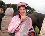 7 September 2013; Jockey William Buick celebrates in the winners enclosure after he rode The Fuge to win the Red Mills Irish Champion Stakes. Leopardstown Racecourse, Leopardstown, Co. Dublin. Picture credit: Barry Cregg / SPORTSFILE