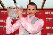 7 September 2013; Jockey William Buick lifts the trophy in the winners enclosure after he rode The Fuge to win the Red Mills Irish Champion Stakes. Leopardstown Racecourse, Leopardstown, Co. Dublin. Picture credit: Barry Cregg / SPORTSFILE