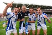 8 September 2013; Waterford players Patrick Curran, left, captain Kevin Daly and Colm Roche, right, alongside selector John Treacy, celebrate with the Irish Press cup after the game. Electric Ireland GAA Hurling All-Ireland Minor Championship Final, Galway v Waterford, Croke Park, Dublin. Photo by Sportsfile