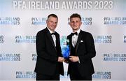 2 December 2023; Sam Curtis of St Patrick's Athletic is presented with the PFA Ireland Men’s Young Player of the Year award by Republic of Ireland U21 manager Jim Crawford during the PFA Ireland Awards 2023 at Anantara The Marker Dublin Hotel in Dublin. Photo by Stephen McCarthy/Sportsfile
