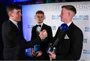 2 December 2023; PFA Ireland Men’s Player of the Year winner Chris Forrester of St Patrick's Athletic, right, is congratulated by teammate Joe Redmond, left, during the PFA Ireland Awards 2023 at Anantara The Marker Dublin Hotel in Dublin. Photo by Stephen McCarthy/Sportsfile