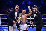 2 December 2023; Jordan Gill with promoter Eddie Hearn, left, and MC David Diamante after his super-featherweight bout against Michael Conlan at the SSE Arena in Belfast. Photo by Ramsey Cardy/Sportsfile