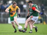 3 December 2023; Gary Sice of Corofin in action against Brian Stack of St Brigid's, 3, during the AIB Connacht GAA Football Senior Club Championship final between St Brigid's, Roscommon, and Corofin, Galway, at Dr Hyde Park in Roscommon. Photo by Piaras Ó Mídheach/Sportsfile