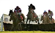 3 December 2023; Farren Glory, centre, with Jack Kennedy up, jumps the last on their way to winning the Bar One Racing Royal Bond Novice Hurdle during day two of the Fairyhouse Winter Festival at Fairyhouse Racecourse in Ratoath, Meath. Photo by Seb Daly/Sportsfile