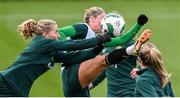 3 December 2023; Goalkeeper Sophie Whitehouse gets to the ball ahead of Erin McLaughlin during a Republic of Ireland women training session at the FAI National Training Centre in Abbotstown, Dublin. Photo by Stephen McCarthy/Sportsfile