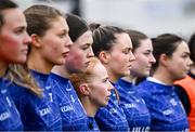 3 December 2023; Marina Cawley of Claremorris, centre, and her teammates stand for Amhrán na bhFiann before the Currentaccount.ie All-Ireland Ladies Junior Club Championship semi-final match between Claremorris of Mayo and Lavey of Derry at Canon Gibbons Park, Claremorris, Mayo. Photo by Harry Murphy/Sportsfile