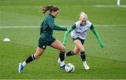 3 December 2023; Katie McCabe in action against Denise O'Sullivan, right, during a Republic of Ireland women training session at the FAI National Training Centre in Abbotstown, Dublin. Photo by Stephen McCarthy/Sportsfile