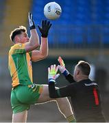 3 December 2023; Liam Silke of Corofin prepares to palm the ball past St Brigid's goalkeeper Cormac Sheedy to score his side's first goal during the AIB Connacht GAA Football Senior Club Championship final between St Brigid's, Roscommon, and Corofin, Galway, at Dr Hyde Park in Roscommon. Photo by Piaras Ó Mídheach/Sportsfile