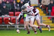 3 December 2023; Brendan Rogers of Slaughtneil in action against Paddy Burke of Ruairí Óg during the AIB Ulster GAA Hurling Senior Club Championship final match between Ruairi Óg, Antrim, and Slaughtneil, Derry, at Páirc Esler in Newry, Down. Photo by Ben McShane/Sportsfile