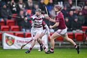 3 December 2023; Brendan Rogers of Slaughtneil in action against Paddy Burke, behind, and Ruairí Ó Mianáin of Ruairí Óg during the AIB Ulster GAA Hurling Senior Club Championship final match between Ruairi Óg, Antrim, and Slaughtneil, Derry, at Páirc Esler in Newry, Down. Photo by Ben McShane/Sportsfile