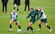 3 December 2023; Saoirse Noonan with Erin McLaughlin, left, and Diane Caldwell, right, during a Republic of Ireland women training session at the FAI National Training Centre in Abbotstown, Dublin. Photo by Stephen McCarthy/Sportsfile