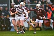 3 December 2023; Jack Cassidy of Slaughtneil in action against Eoghan Campbell, left, and Martin Burke of Ruairí Óg during the AIB Ulster GAA Hurling Senior Club Championship final match between Ruairi Óg, Antrim, and Slaughtneil, Derry, at Páirc Esler in Newry, Down. Photo by Ben McShane/Sportsfile