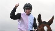 3 December 2023; Jockey Jack Kennedy celebrates after riding Teahupoo to victory in the Bar One Racing Hatton's Grace Hurdle during day two of the Fairyhouse Winter Festival at Fairyhouse Racecourse in Ratoath, Meath. Photo by Seb Daly/Sportsfile