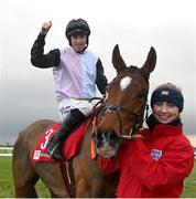 3 December 2023; Jockey Jack Kennedy celebrates with groom Erika Peciulyte after riding Teahupoo to victory in the Bar One Racing Hatton's Grace Hurdle during day two of the Fairyhouse Winter Festival at Fairyhouse Racecourse in Ratoath, Meath. Photo by Seb Daly/Sportsfile