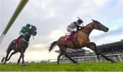 3 December 2023; Teahupoo, right, with Jack Kennedy up, on their way to winning the Bar One Racing Hatton's Grace Hurdle, from second place Impaire Et Passe, left, with Paul Townend up, during day two of the Fairyhouse Winter Festival at Fairyhouse Racecourse in Ratoath, Meath. Photo by Seb Daly/Sportsfile
