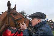 3 December 2023; Winning owner Brian Acheson kisses Teahupoo after victory in the Bar One Racing Hatton's Grace Hurdle during day two of the Fairyhouse Winter Festival at Fairyhouse Racecourse in Ratoath, Meath. Photo by Seb Daly/Sportsfile